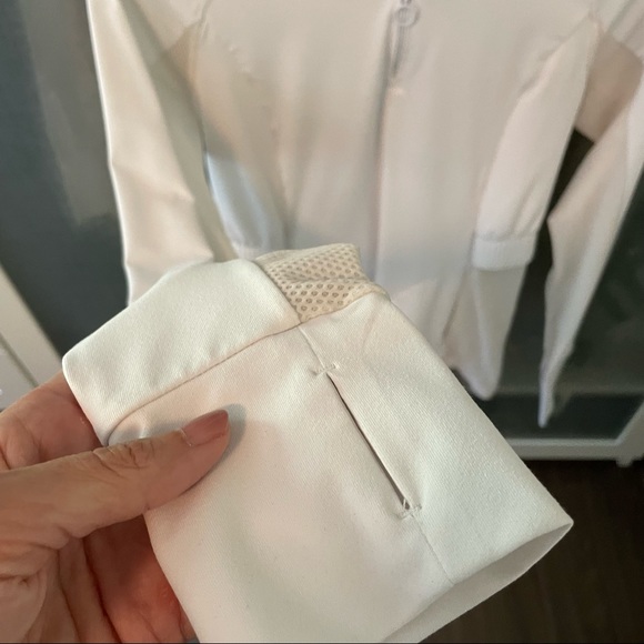 Fabletics long sleeve white pullover jacket with pockets and pouch on back. - Picture 2 of 6